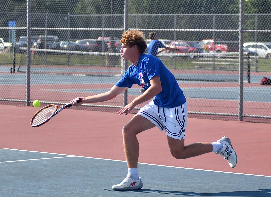 Jay County High School senior swings his forehand during the Patriots’ 4-1 win over Union City on Tuesday. Griffin along with seniors Gabe Pinkerton, Blake Kahlig and Carter Wellman notched their first career victories on varsity. (The Commercial Review/Andrew Balko)