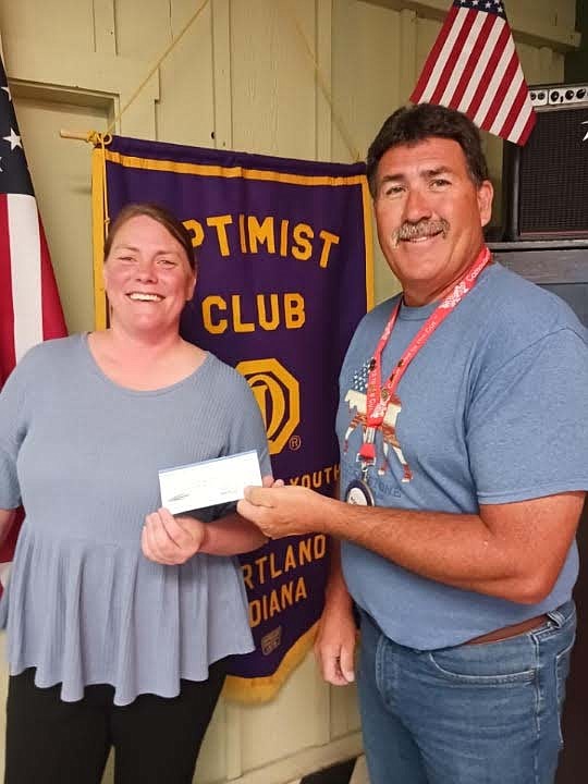 Portland Breakfast Optimist Club recently donated funding to various community activities. Pictured above, Jay County Purdue Extension office director Allison Keen accepts a check from president Rodney Miles for the 4-H Exhibit Hall fund. Portland Breakfast Optimist Club also recently made donations to the Jay County Fourth of July committee for its Independence Day festivities, Jay County Fair Board to sponsor Kids’ Day during the Jay County Fair in July and Portland Junior League to sponsor two teams. (Photo provided)