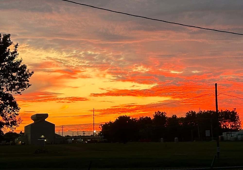 Shades of red, yellow and orange fill the sky Wednesday evening in this view looking toward Portland Forge. Tonight’s forecast calls for partly cloudy skies with a chance of rain. (Special to The Commercial Review/Dylan Lewis)