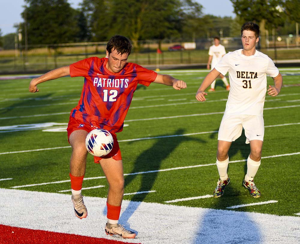 Jay County High School’s Emmitt Reynolds controls a ball during the Patriots’ 4-3 victory over Delta on Thursday. Reynolds passed the game-winning assist to Levi Muhlenkamp with less than a minute left. (The Commercial Review/Ray Cooney)