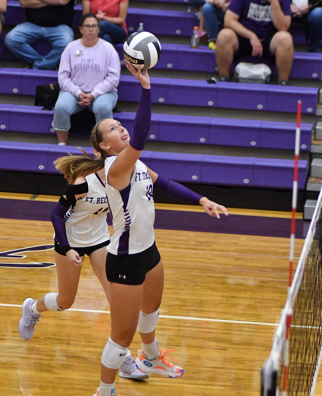 Fort Recovery High School’s Karlie Niekamp attacks the ball during the Indians’ 25-14, 28-26, 25-20 win over Jay County on Tuesday. Niekamp’s six kills was the fourth-most in the match. (The Commercial Review/Andrew Balko)