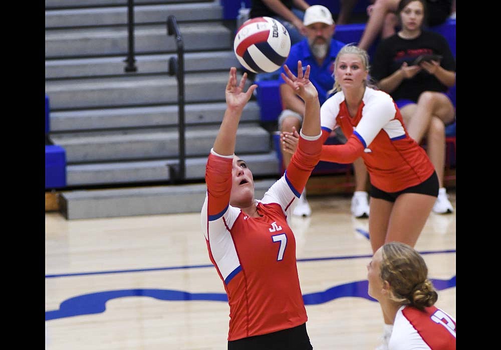 Paisley Fugiett of Jay County High School puts up a set during the Patriots' loss Thursday to Class 2A No. 1 Wapahani. JCHS led through most of the third set before a 5-1 run by the Raiders ended the match. Fugiett finished with 23 assists. (The Commercial Review/Ray Cooney)