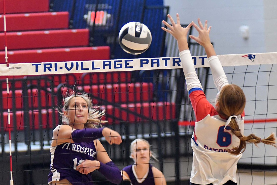 Fort Recovery High School senior Karlie Niekamp hits the ball past the outstretched block of Gabby Kirby during the Indians’ 25-10, 25-18, 25-27, 25-18 win over Tri-Village on Saturday. Niekamp tied with Brynn Willmann and Kennedy Muhlenkamp for eight kills. (The Commercial Review/Andrew Balko)