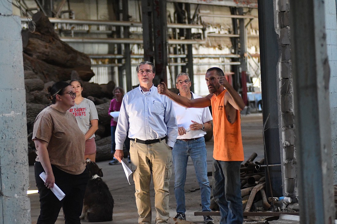 Chad Fifer (right) of Fifer Services explains to city council members, including, from left, Ashley Hilfiker, Kent McClung and Dave Golden, some of the work his company has done to improve the former Sheller-Globe south building since he purchased it from the city. Fifer hopes to utilize the north portion of the main structure as a sawmill and rent the other sections of the building and the outdoor space to other businesses and industries. (The Commercial Review/Ray Cooney)