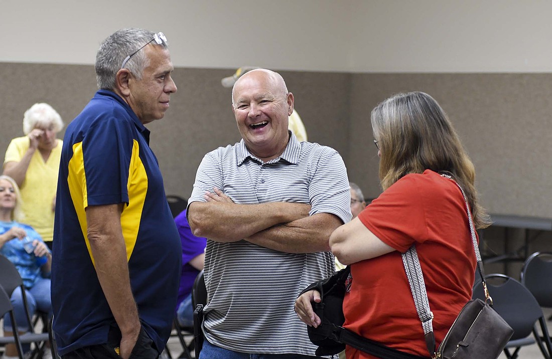 Dunkirk Mayor Jack Robbins laughs while talking with city council member Dan Watson (left) and clerk-treasurer Kara Lowe (right) following his State of the City address Tuesday at West Jay Community Center. Robbins touted business growth in the city and pointed to plans for new housing and potential projects through the Regional Economic Acceleration and Development Initiative (READI) 2.0. (The Commercial Review/Ray Cooney)