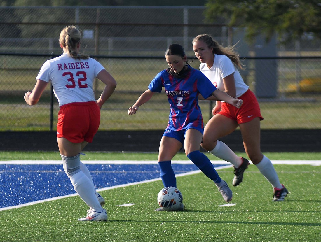 Jay County High School freshman London Lloyd puts the pressure on Wapahani’s defense early in the Patriots 9-1 win on Tuesday. Lloyd scored her second career goal and notched her first assist in the dominant win. (The Commercial Review/Andrew Balko)