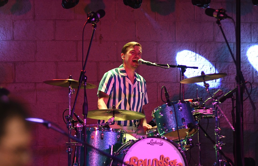 Eric Wernke plays the drums Thursday night as part of the Sounds of Summer: A Beach Boys Tribute Band’s concert to close out Arts Place’s Hudson Family Park Amphitheater series. The four members of the southern Indiana-based band have known each other since elementary school. Wernke works as a high school math teacher in his home town of North Vernon. (The Commercial Review/Ray Cooney)