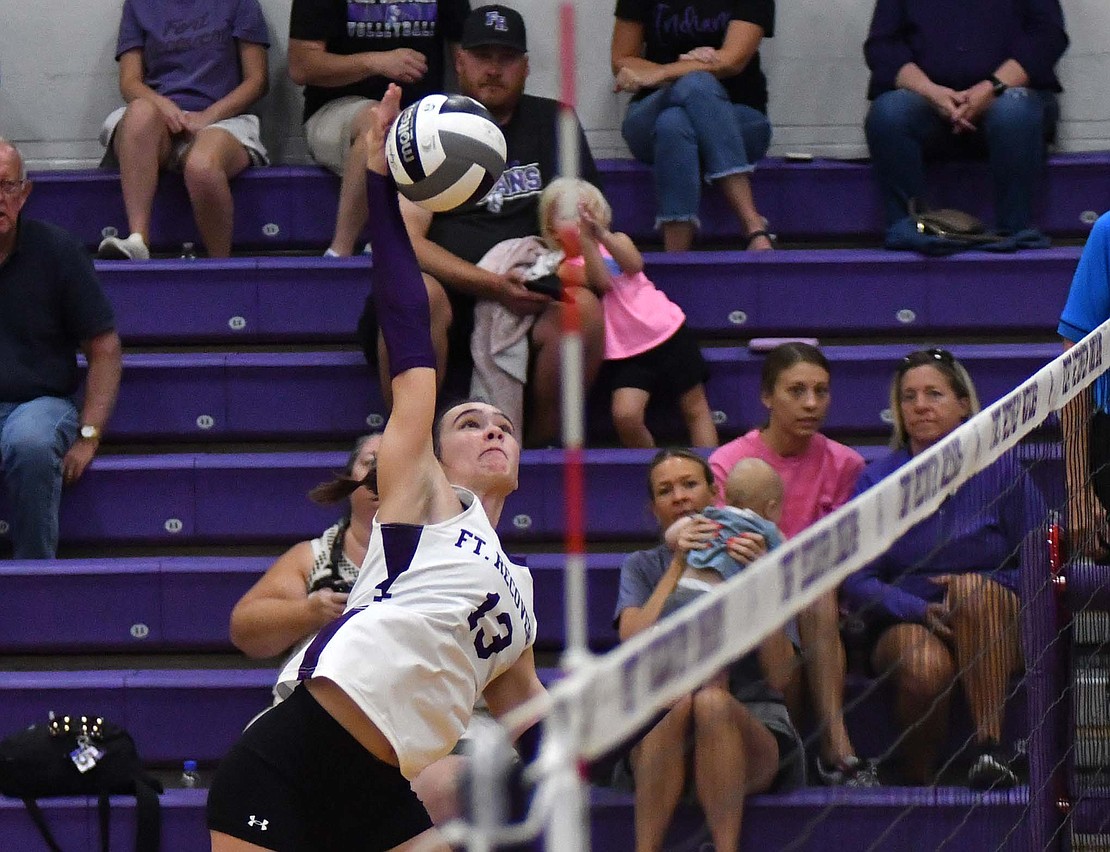 Fort Recovery High School sophomore hitter Cameron Muhlenkamp swings to put down the final kill of the Indians’ 25-8, 25-22, 25-12 victory over Minster on Tuesday. Muhlenkamp had 14 kills in the match to help her team net its first Midwest Athletic Conference victory of the year. (The Commercial Review/Andrew Balko)