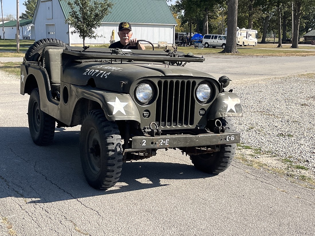 Jim Waechter of Portland drives a 1953 M38A1 into place Thursday morning at Jay County Fairgrounds in preparation for the Indiana Military Vehicle Preservation Association’s Military Vehicle Show and Swap Meet. The event runs from 9 a.m. to 4 p.m. today and 9 a.m. to 3 p.m. Saturday at the fairgrounds. Admission is free. There will also be a military vehicle parade through downtown Portland at 10 a.m. Saturday. Helicopter rides will be available for $50 for children 12 and younger and $100 for adults. (The Commercial Review/Ray Cooney)