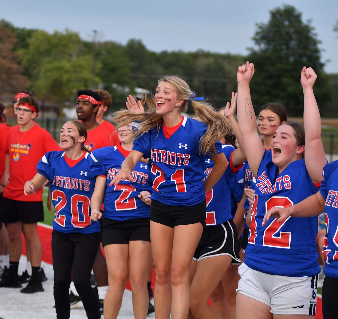 Jay County High School held Spirit Night on Wednesday as part of its homecoming week activities. Pictured above, Jay County seniors Gretchen Link (21) and Jaelynn Lykins (42) start celebrating as Brenna Bailey breaks out for a score in a powderpuff game. Below, junior Garrett Bennett celebrates a turnover on downs that the junior class forced against the sophomores. (The Commercial Review/Andrew Balko)