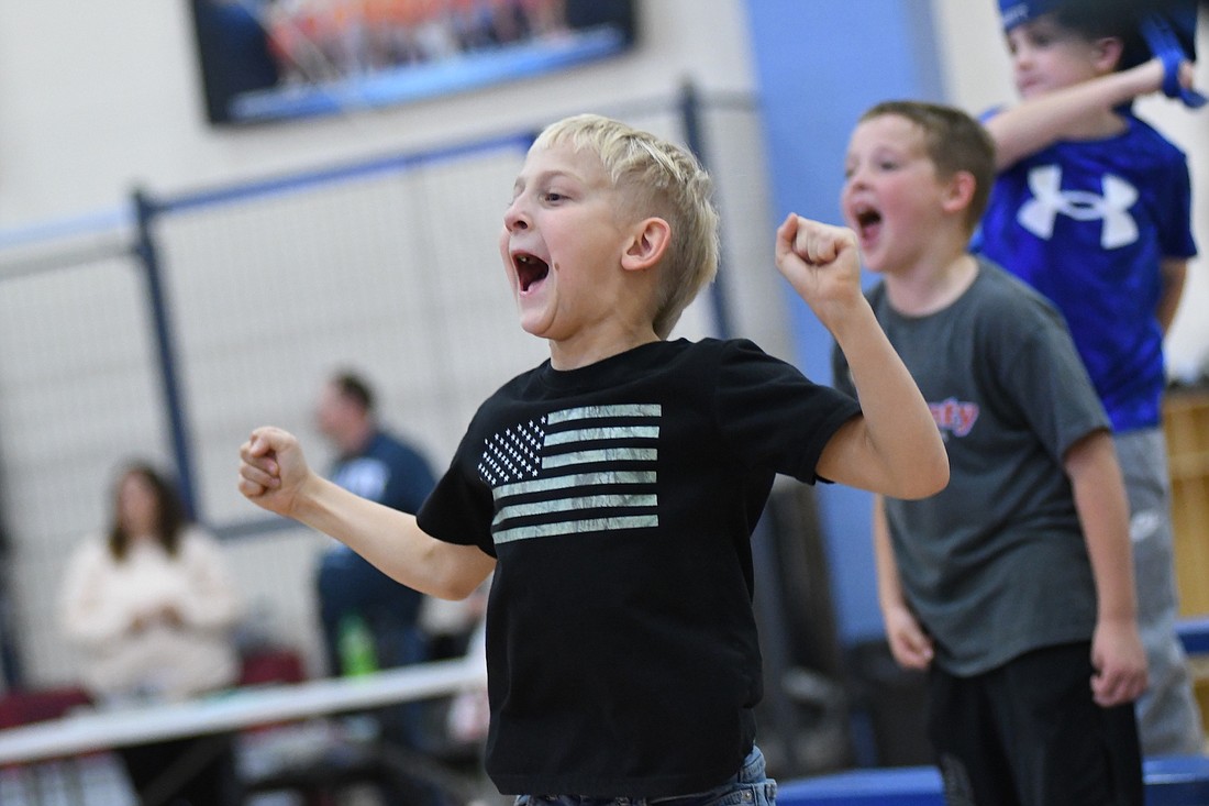 Eight-year-old Eli Michael of Portland cheers Saturday night during the Delaware County Championship Wrestling Invasion V event at Jay Community Center. (The Commercial Review/Ray Cooney)