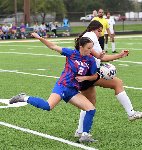 Jay County High School freshman London Lloyd gets physical with Blackford’s Izzy Reader to win possession of the ball during Tuesday’s game. Lloyd scored the first goal of the second half to help the Patriots to a 5-2 triumph. (The Commercial Review/Andrew Balko)