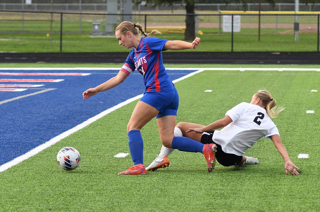 Morgan DeHoff of JCHS breaks Destany Matura’s ankles during the Patriots’ 5-2 win over Blackford on Tuesday. DeHoff dished out two assists, pushing her to seven on the season, which is also most on the team. (The Commercial Review/Andrew Balko)