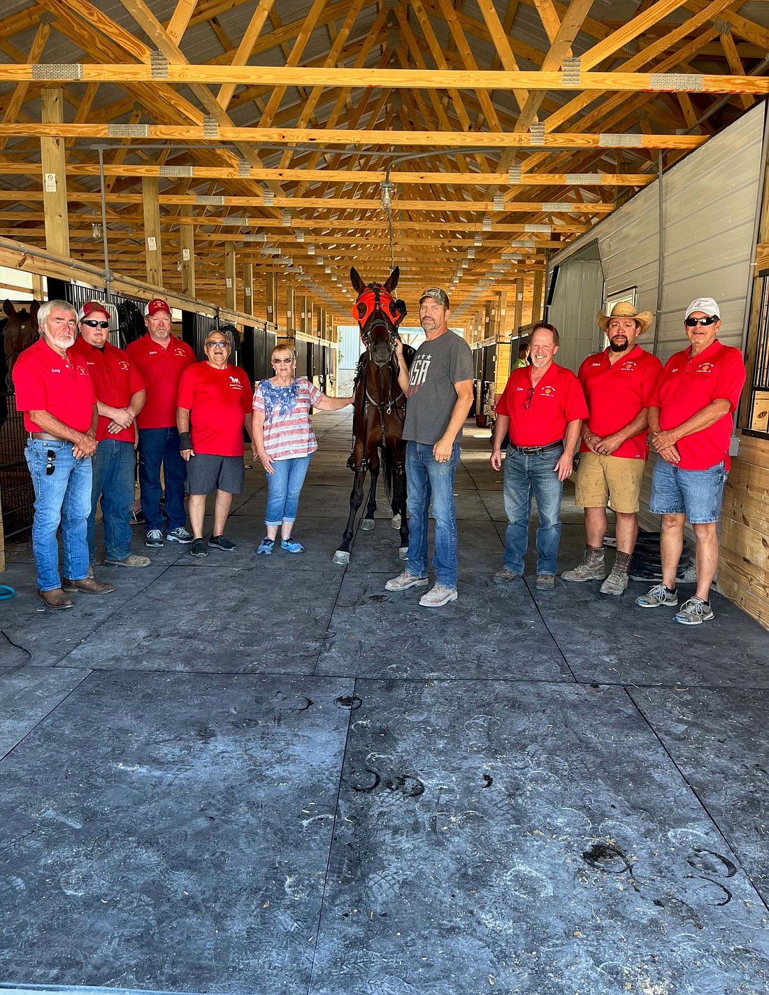 Jay County Fairgrounds celebrated its newly built harness barn before Jayland Trotting Association’s harness race Sept. 21. The barn was built using grant funding from an Indiana State Fair Harness Racing grant. Pictured above, from left, are fair board members Gary Stewart, Brandon Swoveland and Dave Bricker, Jayland Trotting Association representatives Greg and Jane Ann Runyon, harness racing participant Lucien Bowlin, and fair board members Trent Paxson, Dalton VanSkyock and Rick Neargarder. (Photo provided)