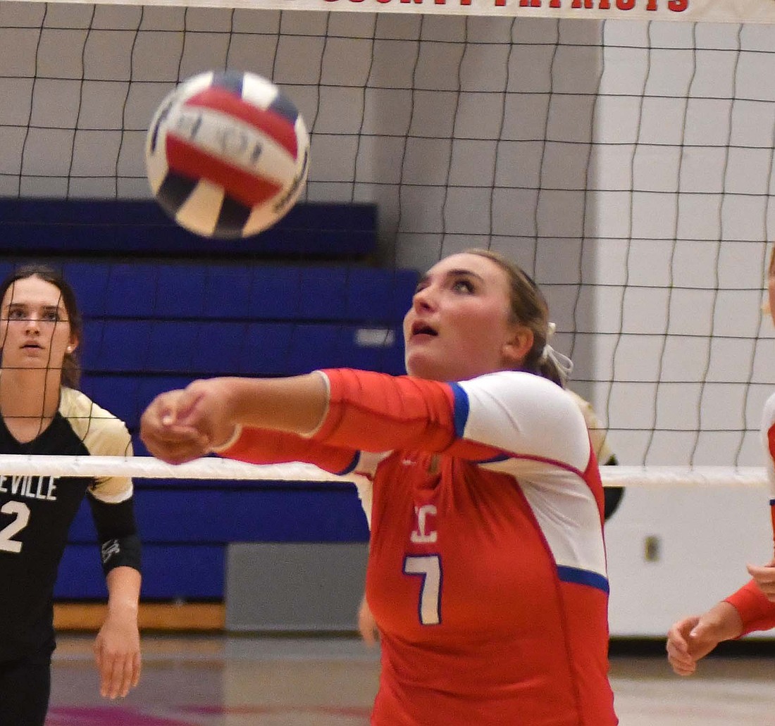 Jay County High School junior setter Paisley Fugiett digs out a ball during the Patriots’ 22-25, 25-19, 25-18, 13-25, 15-13 victory over Daleville on Monday. (The Commercial Review/Will Cash)