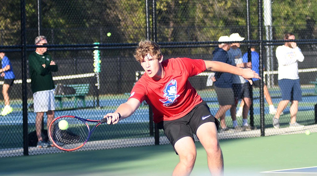 JCHS’ Carter Wellman hits a forehand during Tuesday’s No. 2 doubles match against Delta in the regional opener at Noblesville. Wellman is one of five seniors that had their career end in the 5-0 loss. (The Commercial Review/Andrew Balko)