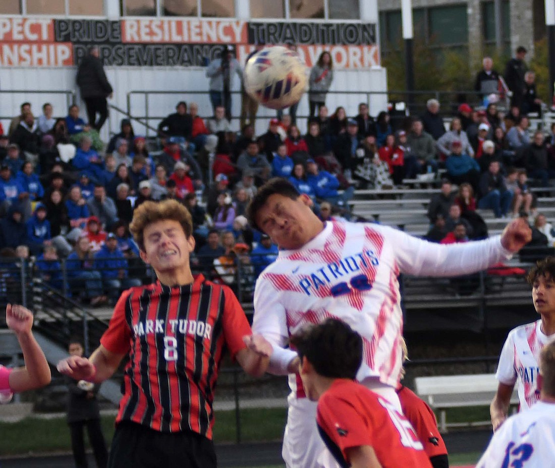 Alan Ortiz, a junior on the Jay County High School boys soccer team, tries to head a ball into the goal from a Dylan Marentes corner kick against No. 6 Park Tudor in the IHSAA Class 2A Regional 12 opener on Thursday. The Patriots hung around with the Panthers to be tied 1-1 through the first half, but couldn’t match PTHS’ three goals in the second. (The Commercial Review/Andrew Balko)