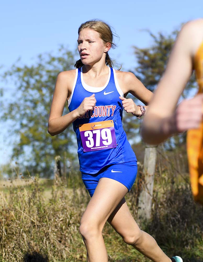 Jay County High School freshman Abby Fifer runs in the sectional meet on Saturday. Fifer finished 14th to help clinch a regional berth. (The Commercial Review/Andrew Balko)