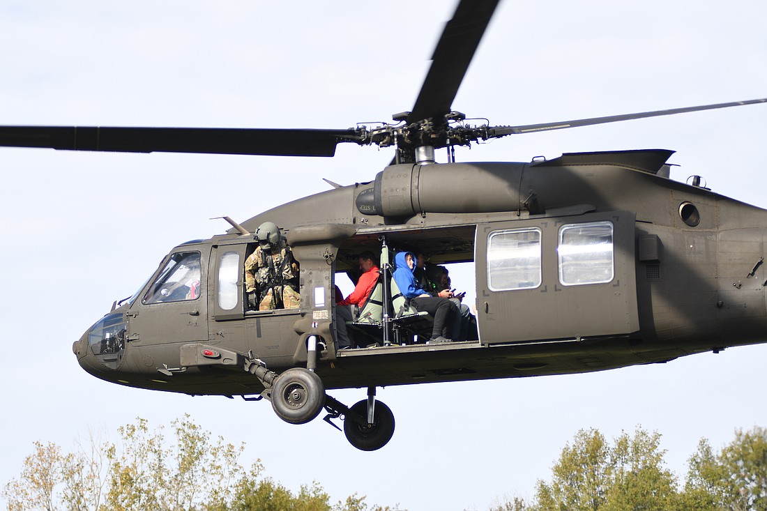 About 80 Jay County Junior-Senior High School students who are involved in the JROTC program and some school staff had the opportunity to fly in a Sikorsky UH-60 Black Hawk military helicopter Wednesday. Students were taken on about a 10-minute flight in the helicopter out of the Indiana National Guard 38th Combat Aviation Brigade in Shelbyville. The Black Hawk is a utility transport and air assault aircraft. (The Commercial Review/Ray Cooney)