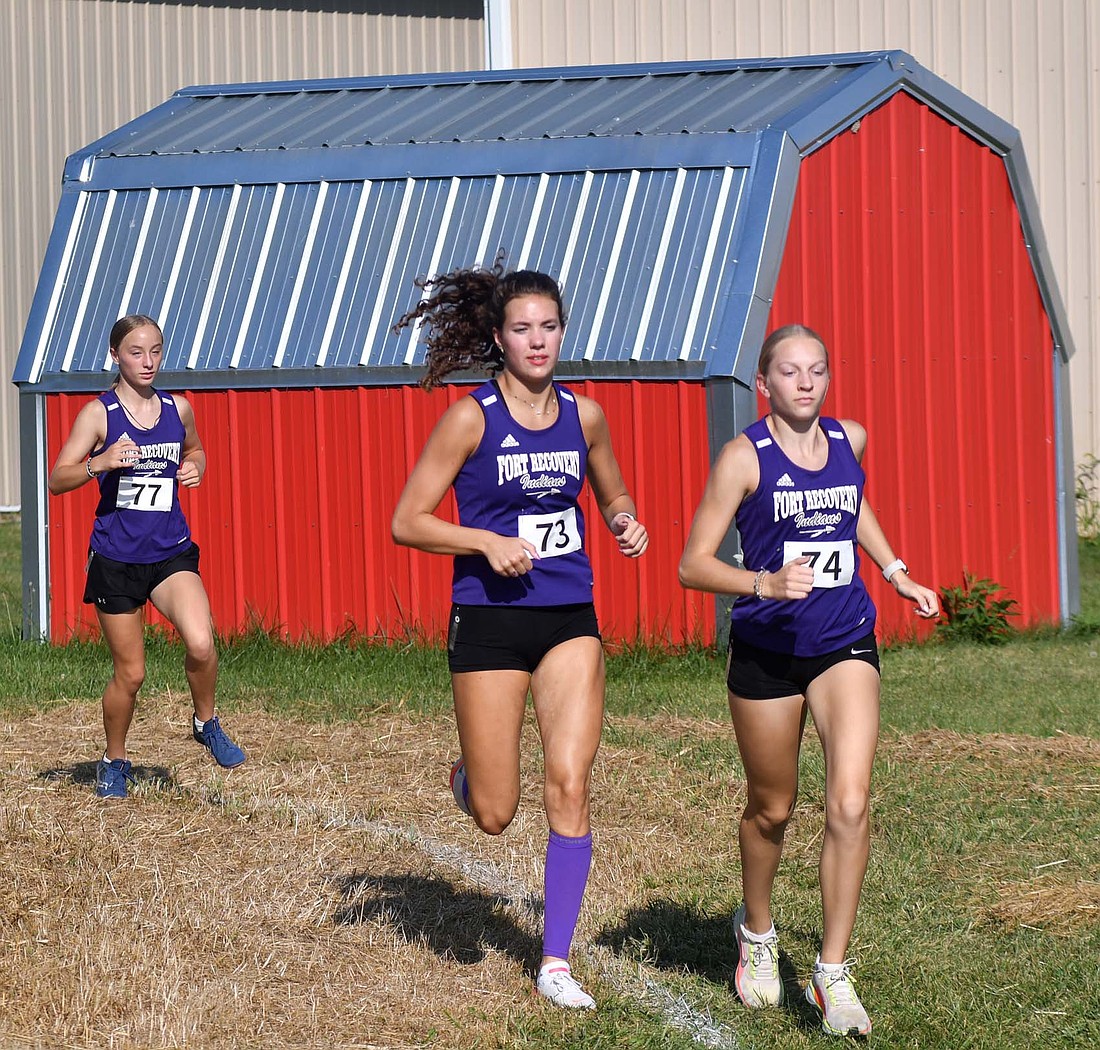 Riley Heitkamp (77), Joelle Kaup (73) and Anna Roessner (74) of Fort Recovery High School lead the field in a dual cross country meet at Jay County on Aug. 28. The girls team, along with Reese Diller, will compete at the regional meet on Saturday. (The Commercial Review/Andrew Balko)