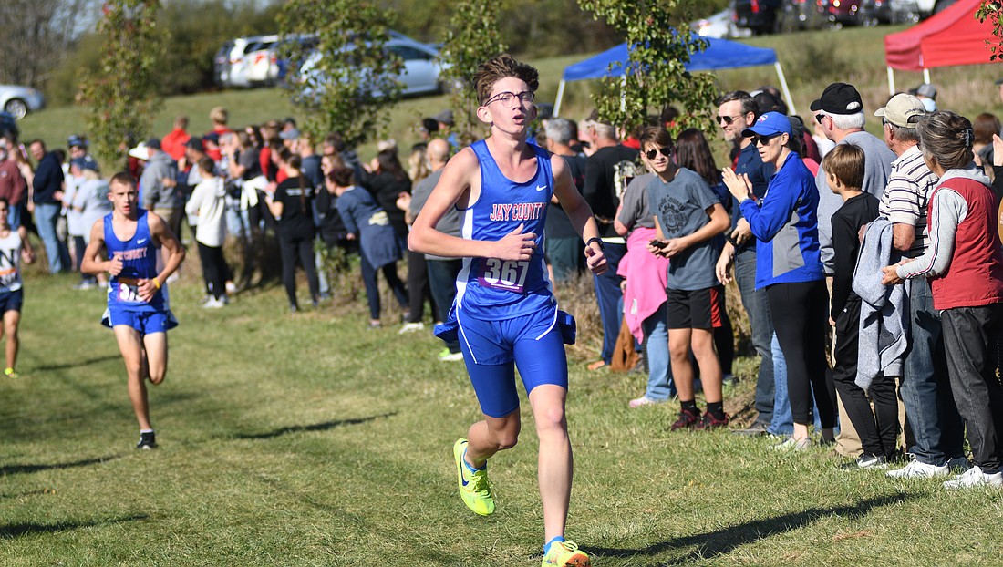 Jay County High School’s Caleb Garringer (367) races in front of Dash Thacker during the IHSAA sectional meet on Oct 19. (The Commercial Review/Ray Cooney)