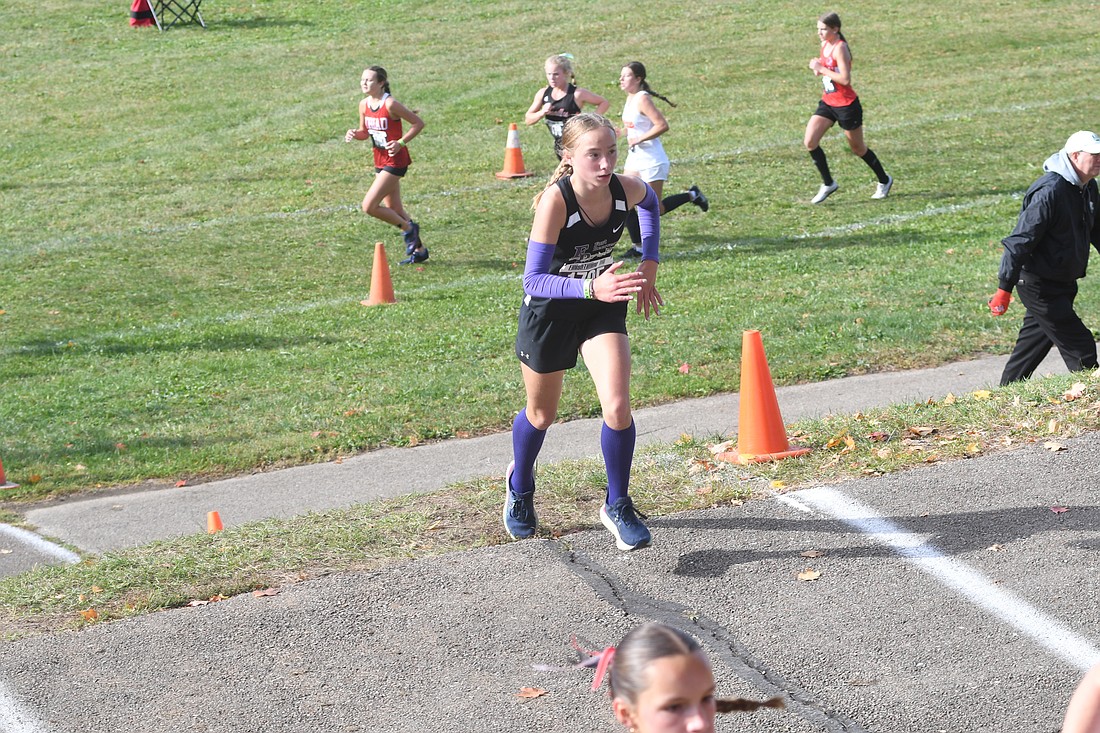 Fort Recovery High School freshman Riley Heitkamp climbs a hill at the two-mile mark of the OHSAA Division III Southwest District 12 regional meet at Troy on Saturday. Heitkamp finished 58th in her regional debut. (The Commercial Review/Andrew Balko)