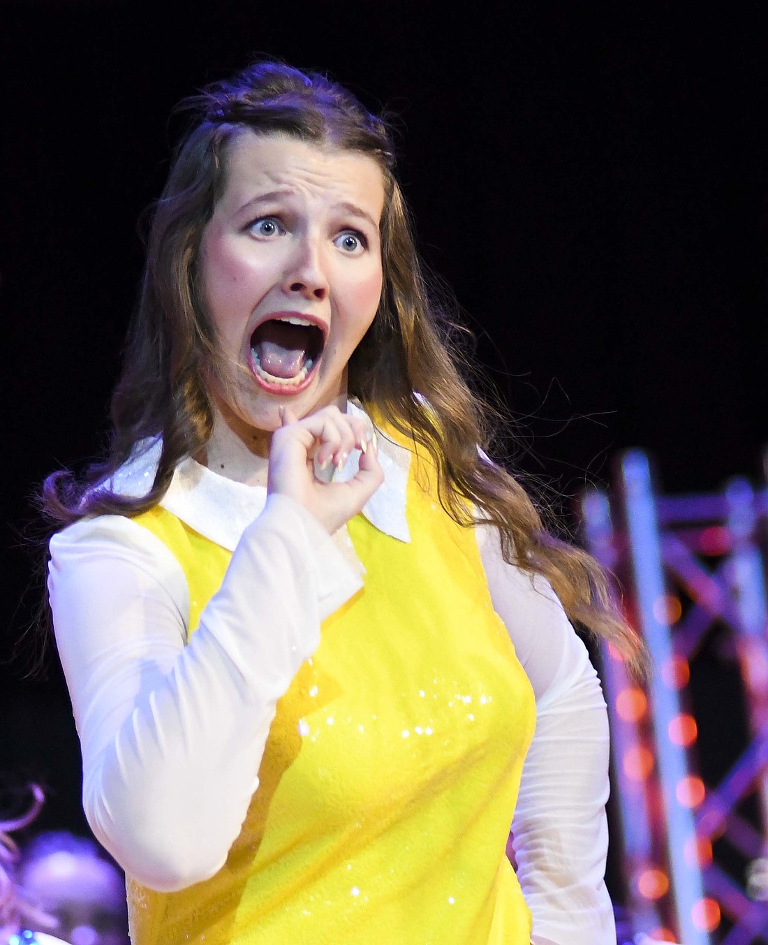 Ellie Darnell shows plenty of expression Sunday afternoon during Just Treble’s performance of its “Madeline”-themed show at Jay County Junior-Senior High School’s fall choral concert. Just Treble, the high school’s all-girl group, and the co-ed Patriot Edition debuted their 2024-25 competition shows while the junior high choir performed a selection of songs, including “We Are Warriors.” (The Commercial Review/Ray Cooney)