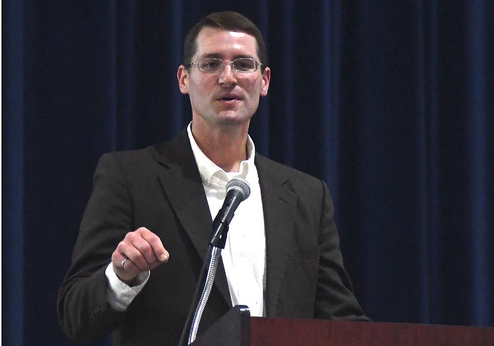 Jay County Development Corp-oration executive director Travis Richards speaks during the 2022 Launch Jay! business pitch competition at Jay County Junior-Senior High School. Richards submitted his letter of resignation as executive director Monday. His last day on the job will be Nov. 15, though he plans to continue to assist with ongoing efforts such as the Regional Economic Acceleration and Development Initiative (READI) 2.0. (The Commercial Review/Ray Cooney)