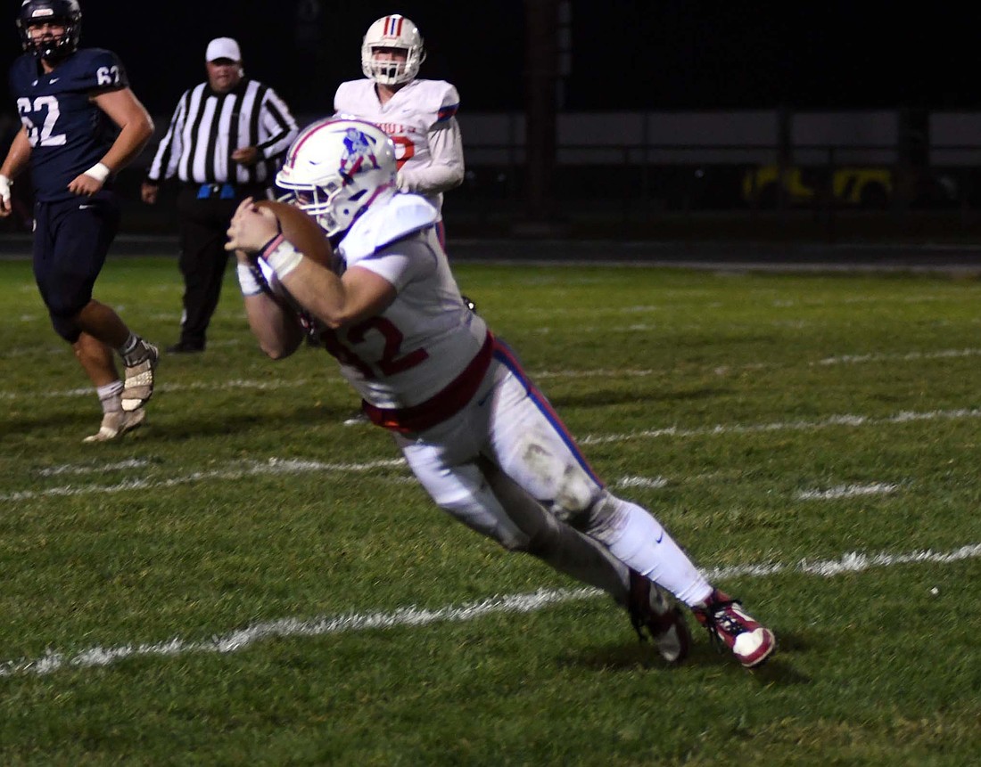 Jay County High School’s Garrett Bennett pulls in a catch during the 42-7 victory at Bellmont in the sectional opener on Oct. 25. The Patriots will host Bishop Luers in their first sectional semifinal since 2017. (The Commercial Review/Andrew Balko)