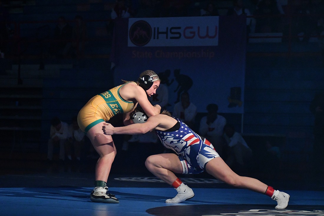 Mallory Winner of Jay County High School makes a move at Rhaigyn “Turtle” Trenary’s (Eastside) legs during the 155-pound 2024 girls wrestling state championship. Winner beat Trenary 6-0 to claim her third state title and will look to win her fourth, the first as an official IHSAA sport, this season. (the Commercial Review/Andrew Balko)