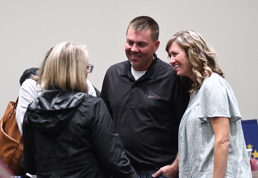 Jay County Commissioner-elect Duane Monroe grins while chatting with his wife Rhonda (right), Krista Muhlenkamp (foreground left) and Sue Bailey on Tuesday during a gathering of local Republicans at John Jay Center for Learning. Monroe totaled 81% of the vote as the Republican dominated Democrat Blake Watson in the race for the south district seat. (The Commercial Review/Ray Cooney)