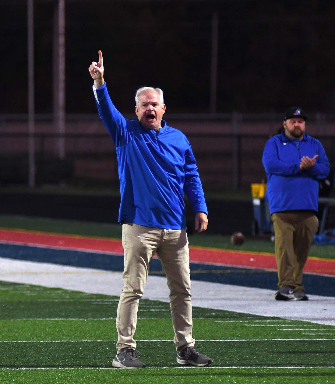 Jay County High School football coach Grant Zgunda calls for his team to kick the point after touchdown following the score on the opening drive in the 35-13 loss at Heritage Oct. 18, 2024. After leading the Patriots for four years, Zgunda will retire from coaching and teaching at Jay County. (The Commercial Review/Andrew Balko)