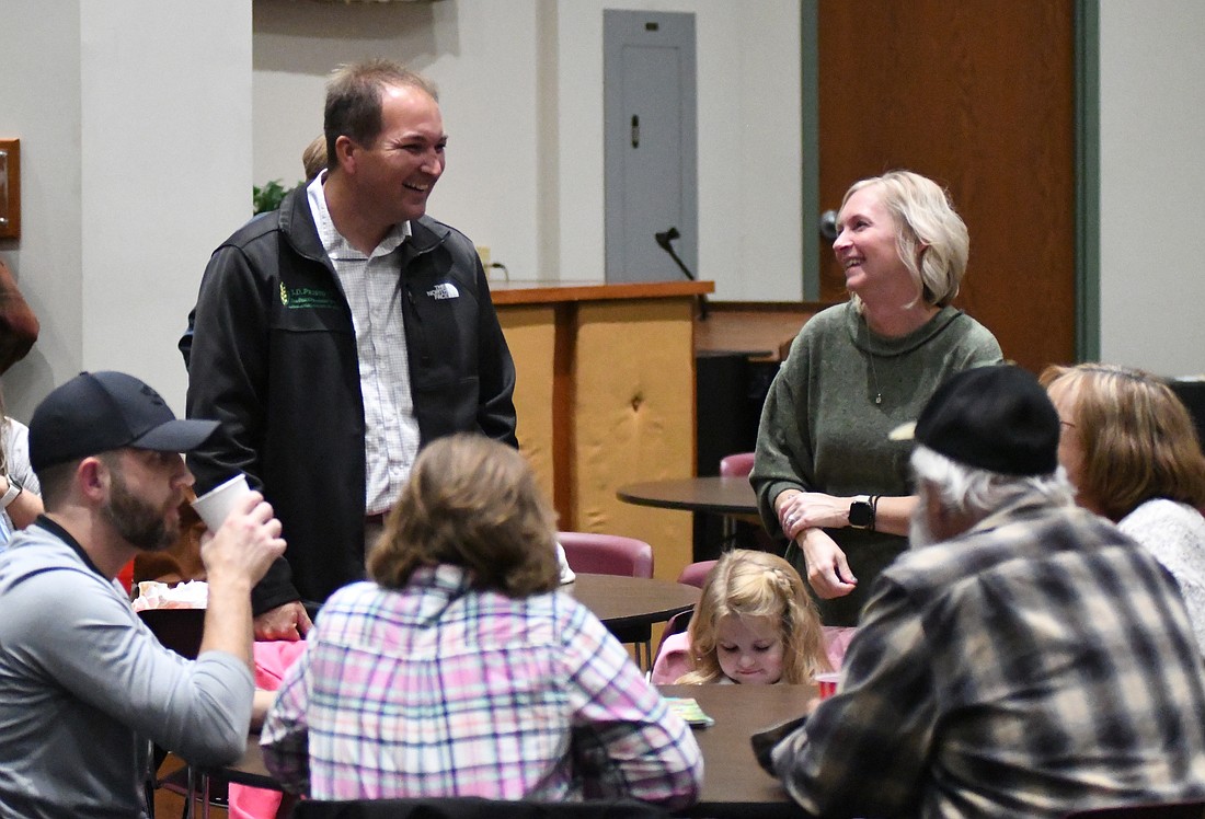 State Representative J.D. Prescott (R-Union City) laughs while chatting with Jonelle Foreman on Tuesday during a gathering of local Republicans to follow election results at John Jay Center for Learning. Prescott was elected to a fourth term representing District 33, which includes all of Jay, Randolph and Blackford counties and part of Delaware and Henry counties. Foreman was elected as Jay County’s next treasurer. (The Commercial Review/Ray Cooney)