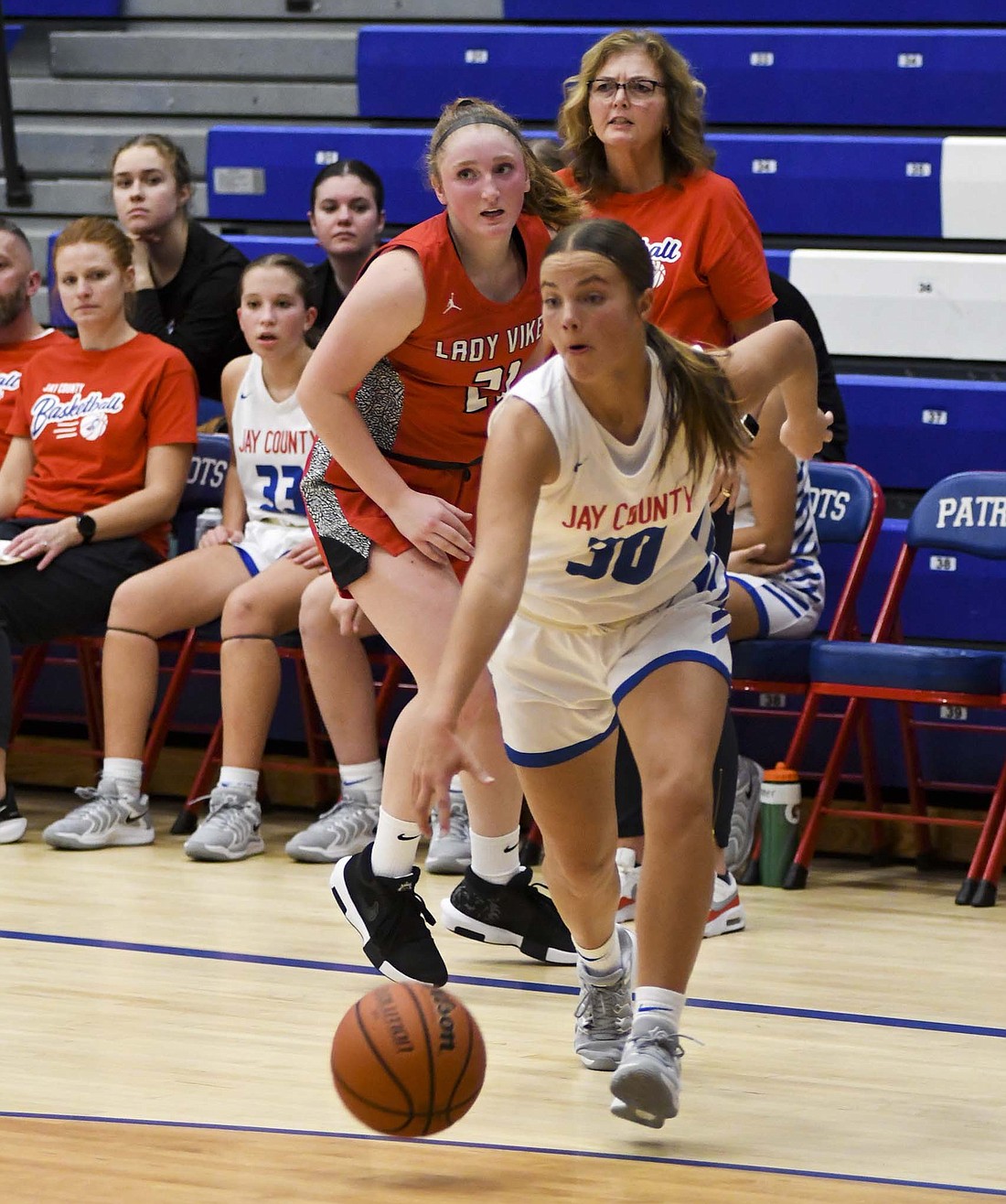 Elizabeth Brunswick, a freshman on the Jay County High School girls basketball team drives to the basket during the scrimmage against Huntington North on Tuesday. Brunswick is one of six freshmen joining the Patriots this year. (The Commercial Review/Andrew Balko)