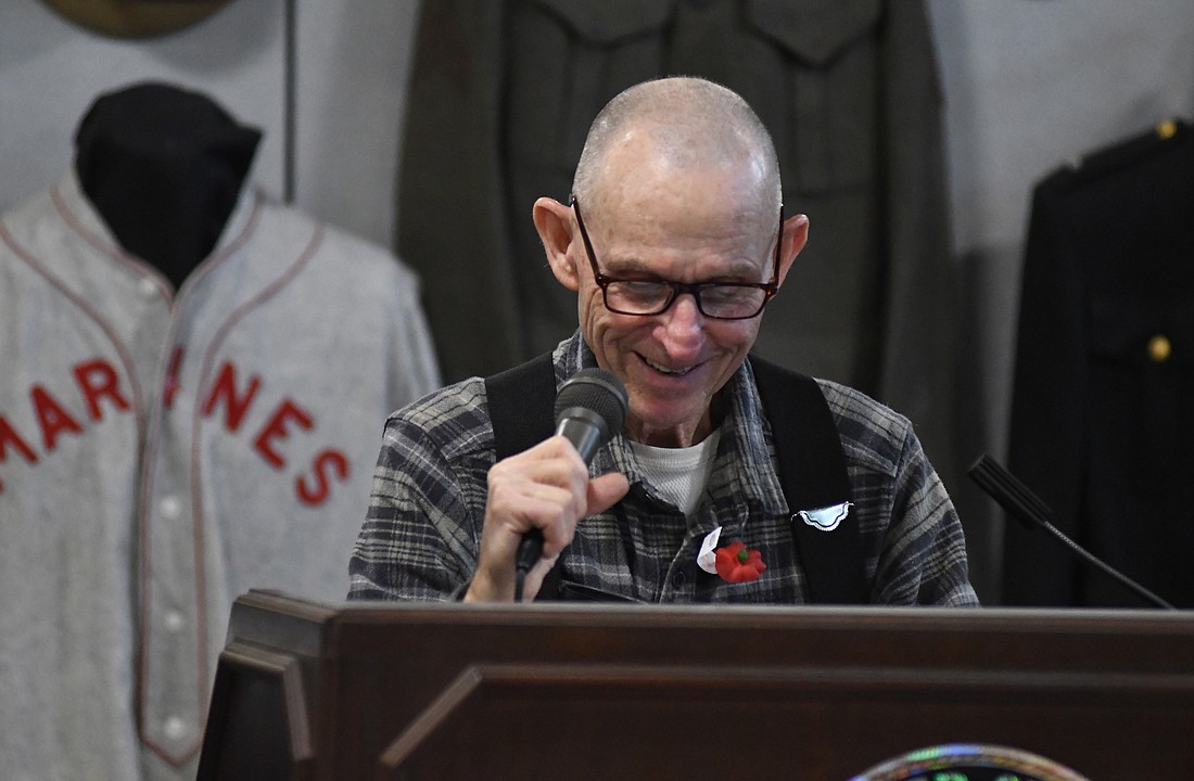 Various ceremonies were held in the community over the weekend and Monday in observance of Veterans Day. Pictured above, veteran John Gibson reads a message from Gen. Eric M. Smith, commandant of the U.S. Marine Corps, during Sunday’s Marine Corps birthday party at Museum of the Soldier in Portland. Below, JROTC member Haley Ridenour reviews her remarks before speaking during a ceremony at Jay County Junior-Senior High School. (The Commercial Review/Ray Cooney)