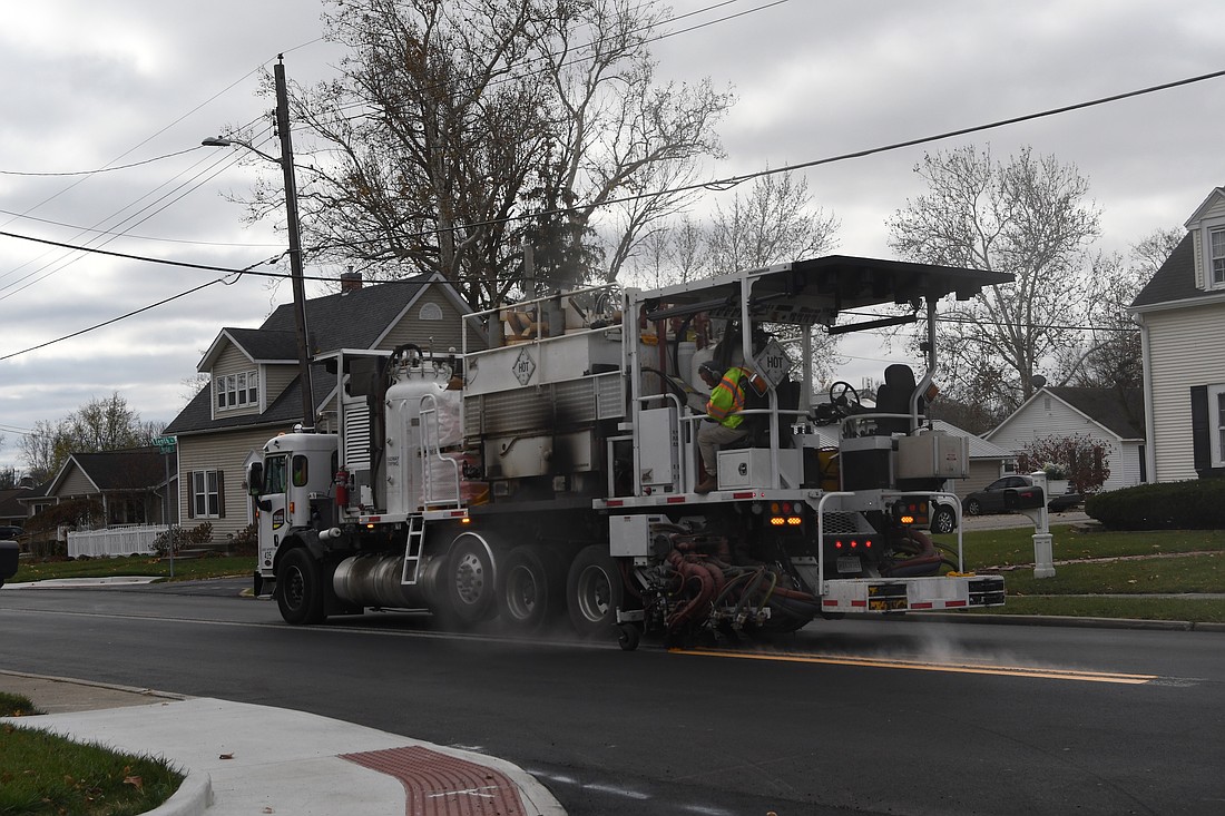 Indiana Sign and Barricade was in Portland on Tuesday working on putting down lane lines on Meridian Street (U.S. 27) as part of the ongoing construction project. Pictured, the firm paints the center lines along Meridian Street near its intersections with Floral Avenue and Tenth Street. The Indiana Department of Transportation project includes paving Meridian Street in the city as well as new Americans with Disabilities Act accessible ramps and new traffic signals. (The Commercial Review/Ray Cooney)