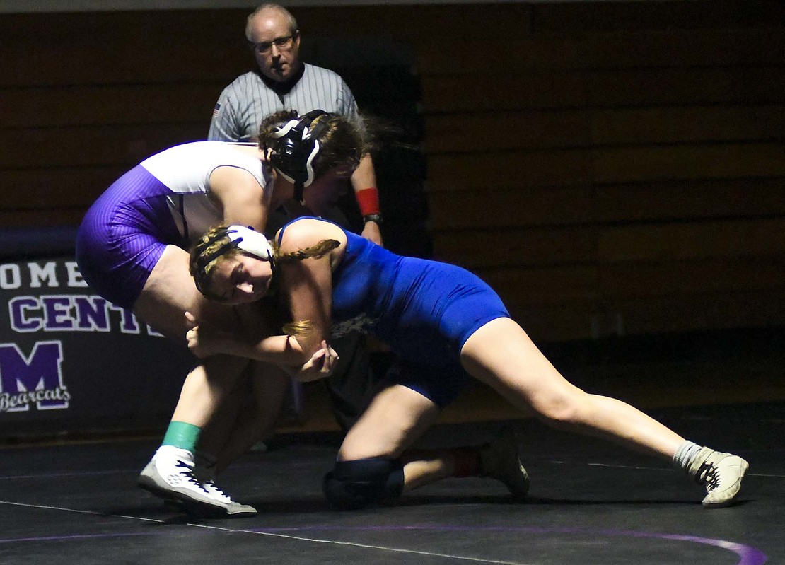 Emily Manor of JCHS takes a shot at the Bearcats’ Learah Rollins during the 140-pound match Thursday. Manor won the match by fall with 1:49 left in the third period. (The Commercial Review/Andrew Balko)