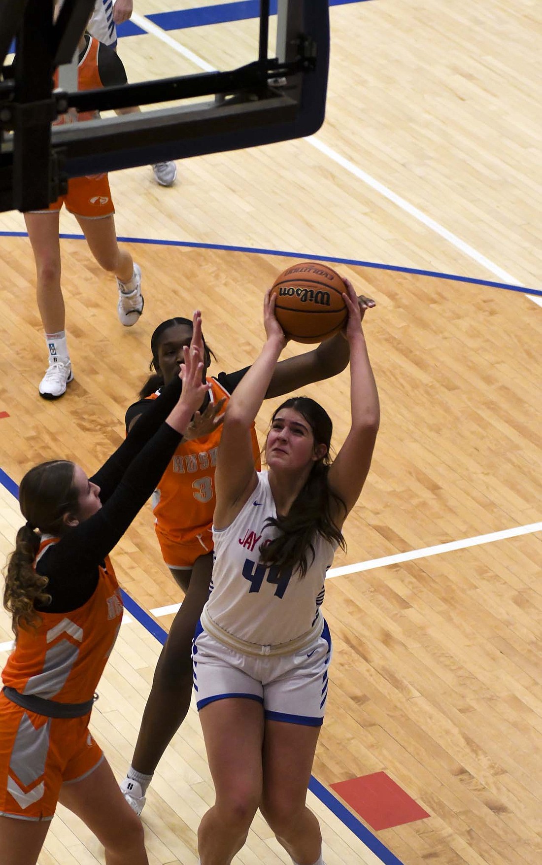 Amelia Heath, a freshman at JCHS, powers up for a bucket off of an offensive rebound with 40 seconds left in the second quarter Saturday. Heath tied Elizabeth Brunswick at seven points, the most by the Patriot freshmen. (The Commercial Review/Andrew Balko)