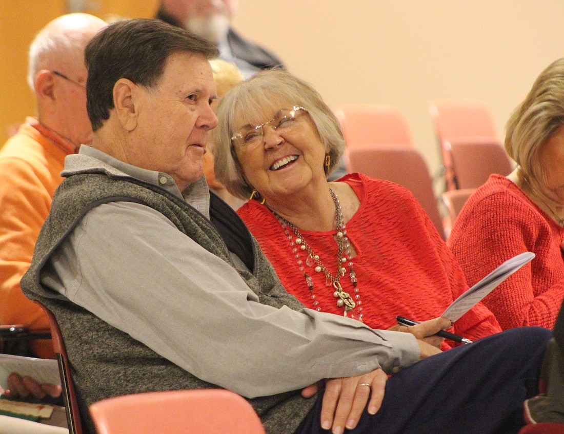 A busy weekend of holiday events kicked off Friday evening with Christmas at the Courthouse and the Arts Place Holiday Benefit Auction. Pictured above, Diane Coldren of Portland laughs while chatting with her husband John as he was bidding during the auction in Goodrich Hall on the Jay County Campus of Arts Place. Additional events this weekend include the Little Miss Winterfest pageant at 2 p.m. today at Fellowship Baptist Church and the Parade of Lights at 6:30 p.m. in downtown Portland. Dunkirk will launch its season of celebration with Feel the Warmth of Christmas on Monday evening in the downtown area, with Santa slated to arrive at 5:30 p.m. (The Commercial Review/Bailey Cline)