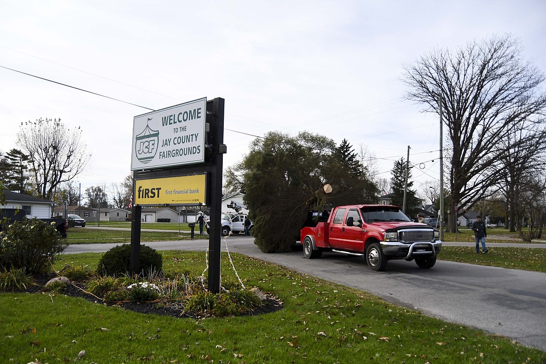 Once the trees were down, they were hauled on long trailers along Western Avenue, Blaine Pike, Water Street, Meridian Street, Depot Street and Votaw Street through the main entrance of Jay County Fairgrounds (pictured). “I kind of got goosebumps watching the trees go down the street,” said Aaron Loy, “a police escort, people stopping in the middle of the road, out on the sidewalks, just taking pictures and videos. It’s pretty amazing, not something you would expect to see in Portland.” (The Commercial Review/Ray Cooney)