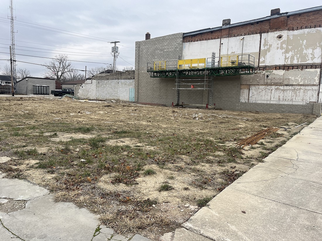 Work is underway this week to put a new facade wall on the east side of The Greazy Pickle in Portland where an adjacent structure was torn down late last year. Portland Park Board president Brian Ison shared an initial idea to create a “social park” in the space at Tuesday’s meeting. The board gave its informal initial support to the idea that could include a fire pit, cornhole courts, lighting, vegetation and open space for events. (The Commercial Review/Ray Cooney)