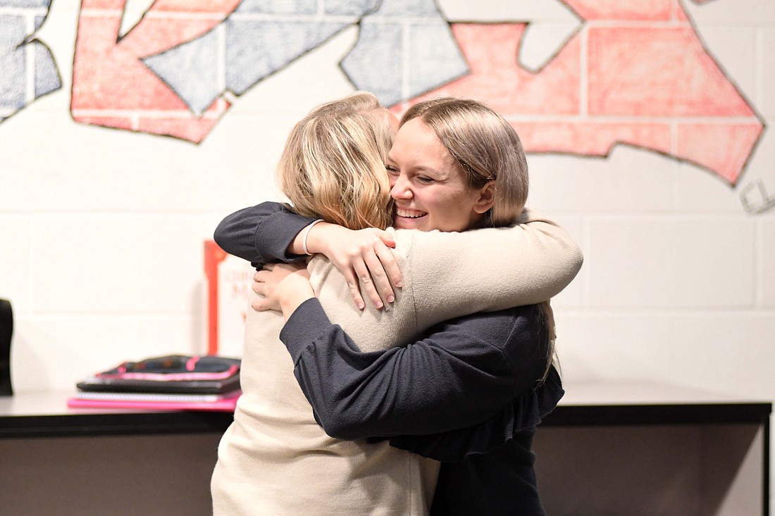 Jay County High School senior Aubrey Millspaugh hugs Krista Muhlenkamp of The Portland Foundation’s scholarship selection committee after being informed that she was selected as the 2025 Lilly Endowment Community Scholar. The honor includes full tuition to any Indiana college or university as well as funding for fees and books. (The Commercial Review/Ray Cooney)