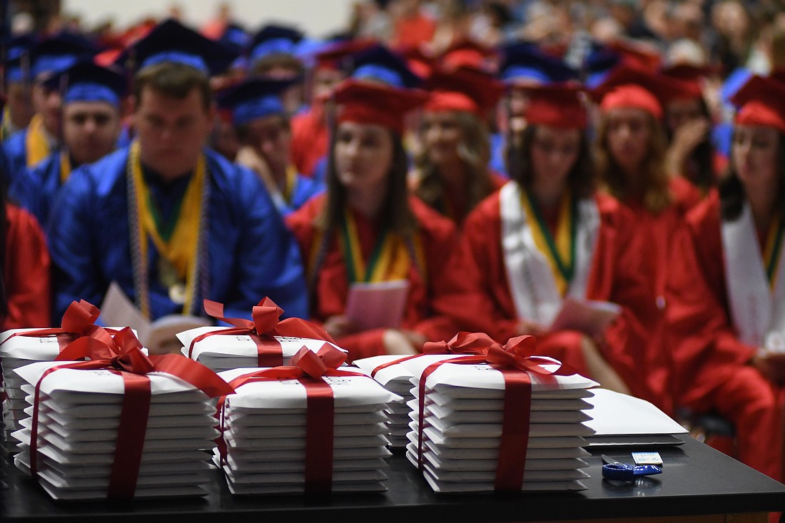 Diplomas are stacked on a table waiting to be handed out to graduates during the 2022 Jay County High School commencement ceremony. Indiana education officials on Wednesday approved a plan that would modify the state’s graduation requirements. The plan aims at increasing flexibility and providing various graduation pathways that include internships, apprenticeships, military experience and work-based learning. The final step toward approving the new diploma requirements is having them signed off by the state attorney general. (The Commercial Review/Ray Cooney)