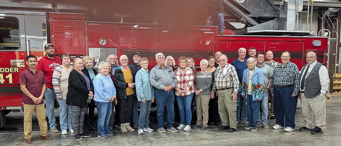 Portland Evening Optimist Club recently honored Portland firefighters for their service to the community with a carry-in supper at the Portland Fire Department.  Firefighters were also presented with a thermal beverage tumbler. Pictured are members of the Portland Evening Optimist Club and firefighters with Portland mayor Jeff Westlake and fire chief Mike Weitzel. (Photo provided)