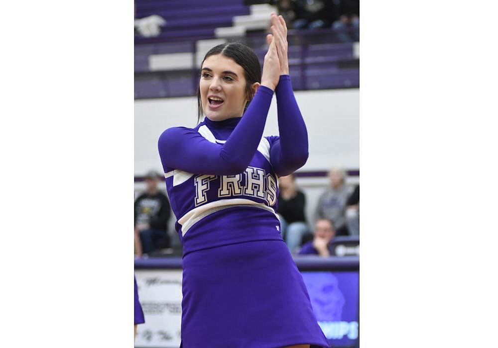 Fort Recovery High School cheerleader Trinity Rammel performs during halftime of Friday’s boys basketball game against the Parkway Panthers. The FRHS cheerleaders danced to Christmas tunes for their halftime performance. (The Commercial Review/Ray Cooney)