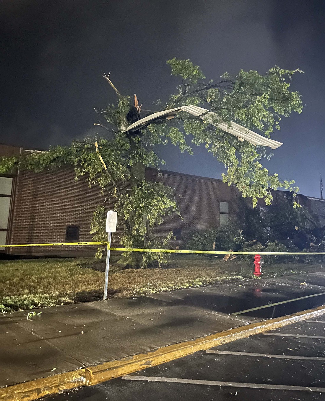 Jay County Junior-Senior High School was severely damaged during a tornado on the evening of Sunday, Sept. 22. Pictured above, a piece of metal debris is intertwined with a snapped tree in front of the junior-senior high. All Jay Schools were closed the next day, with the junior-senior high shuttered for a full week. Students were then shifted from the damaged section of the building to underutilized spaces before moving to mobile classrooms on Dec. 2. The Commercial Review’s staff selected the tornado and the extensive damage to the school as its top local news story of 2024. (The Commercial Review/Ray Cooney)