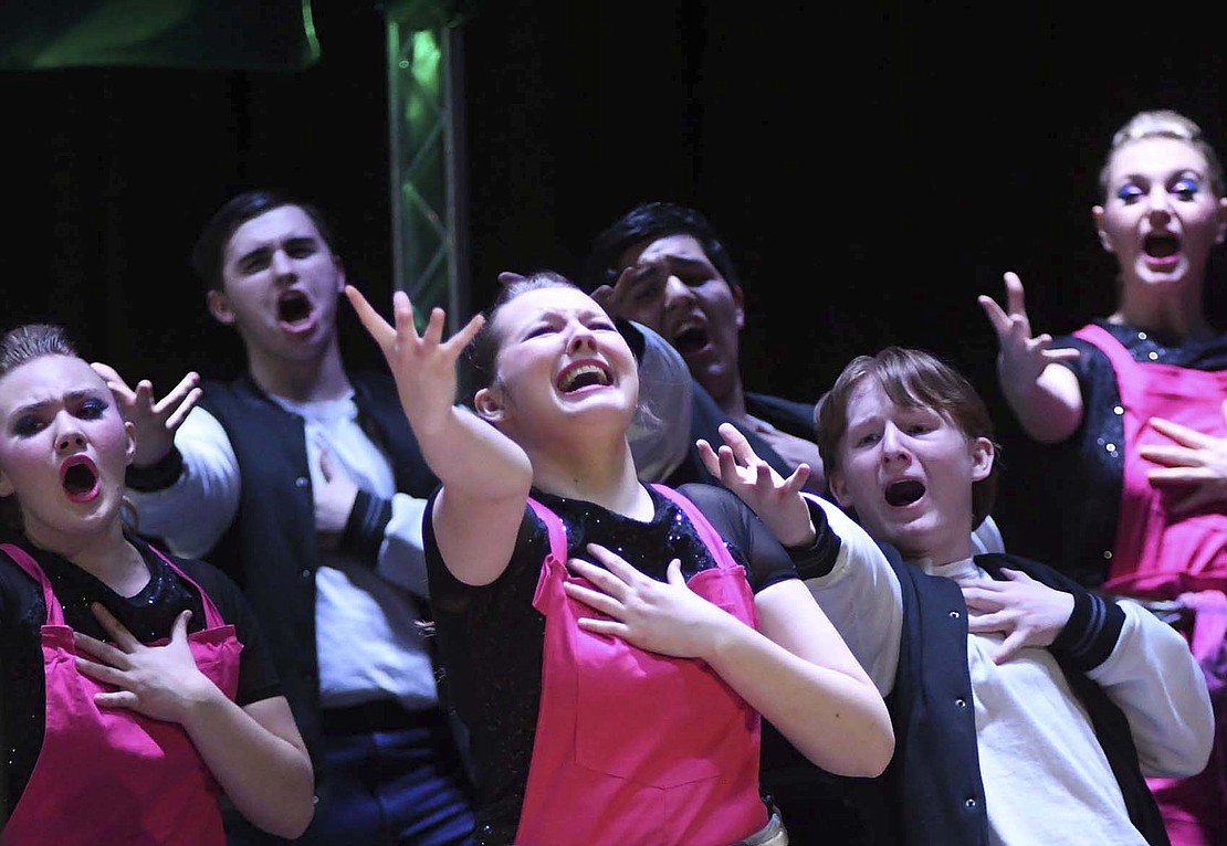 The Jay County High School show choirs performed their competition shows in front of their home crowd March 4. Pictured Ellie Darnell (center) performs as part of Patriot Edition. Surrounding her, from left, are Tessa Miller, Ethan Garrison, Junior Blazquez and Gavin Hambrock. (The Commercial Review/Ray Cooney)