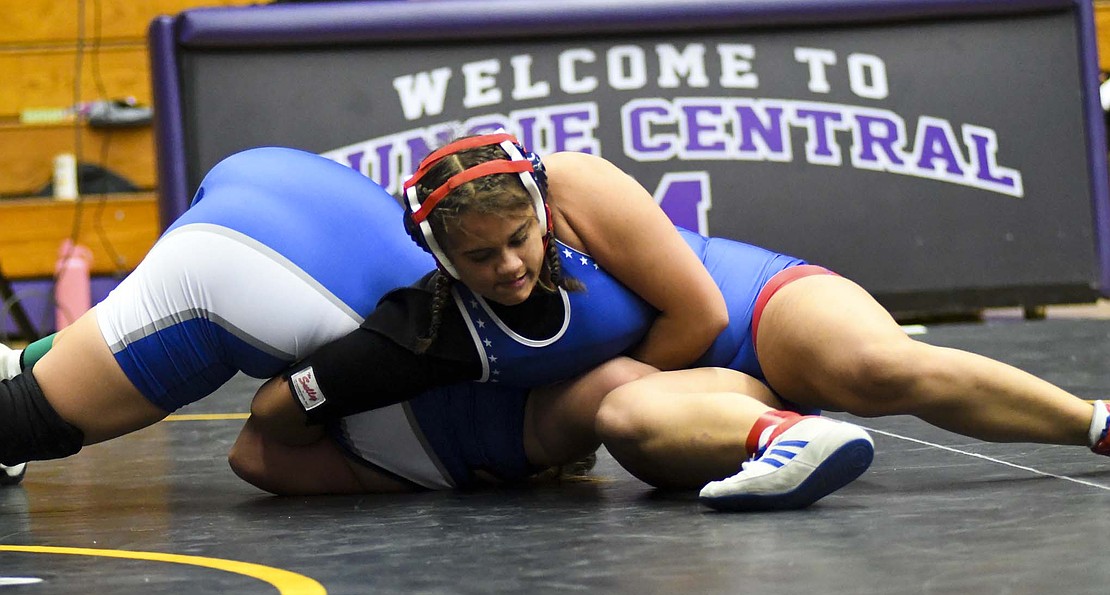 No. 5 Amara Crawford (33-4), a freshman on the Jay County High School girls wrestling team, runs a double wrist bar or a “walker” on Hamilton Southeastern’s Kelli Crawford (4-3) during the 190-pound semifinal match at the inaugural IHSAA Sectional 10 meet hosted by Muncie Central on Friday. Crawford was one of six Patriots to claim the sectional title, helping the team claim the top spot with 232 points. (The Commercial Review/Andrew Balko)