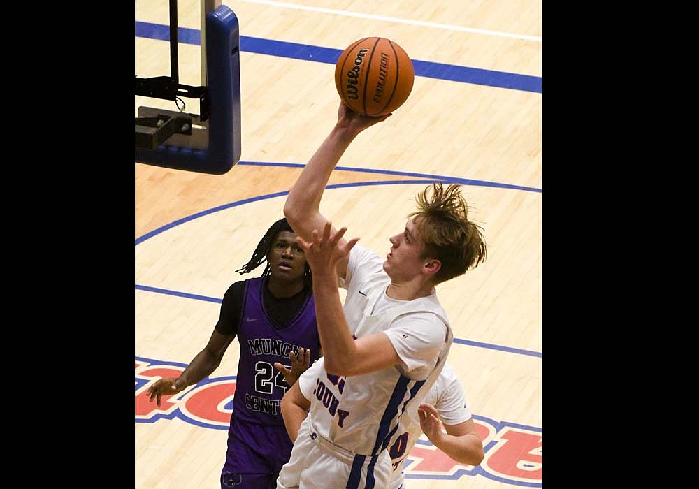 Gradin Swoveland, a junior at Jay County High School, glides in for a layup during the Patriots’ 36-28 victory over Muncie Central on Saturday. Swoveland led JCHS with 16 points in the game, including eight in the fourth quarter. (The Commercial Review/Andrew Balko)