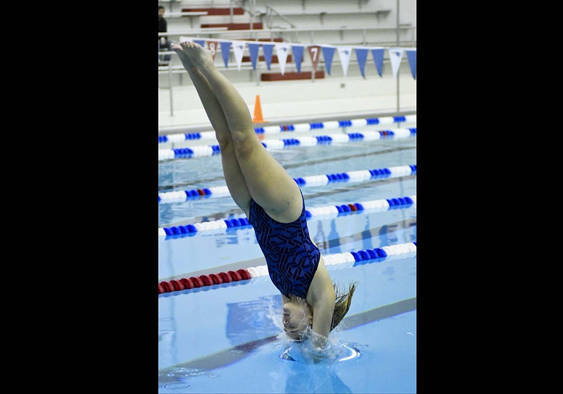 Maddy Snow of Jay County hits the water on her front one-and-one-half that secured her second place in Friday’s diving competition. The meet served as a measuring stick as she begins the run toward the Allen County Athletic Conference Championships and sectional meet. (The Commercial Review/Ray Cooney)